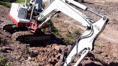 mini excavator on hillside|steep slope mini excavator.